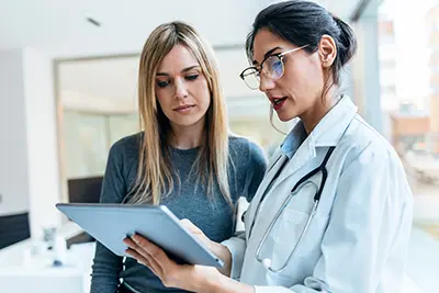 woman speaking with her doctor